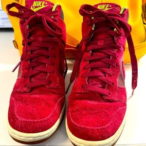 Women’s 6.5 Nike high top high heel hidden wedge sneaker.